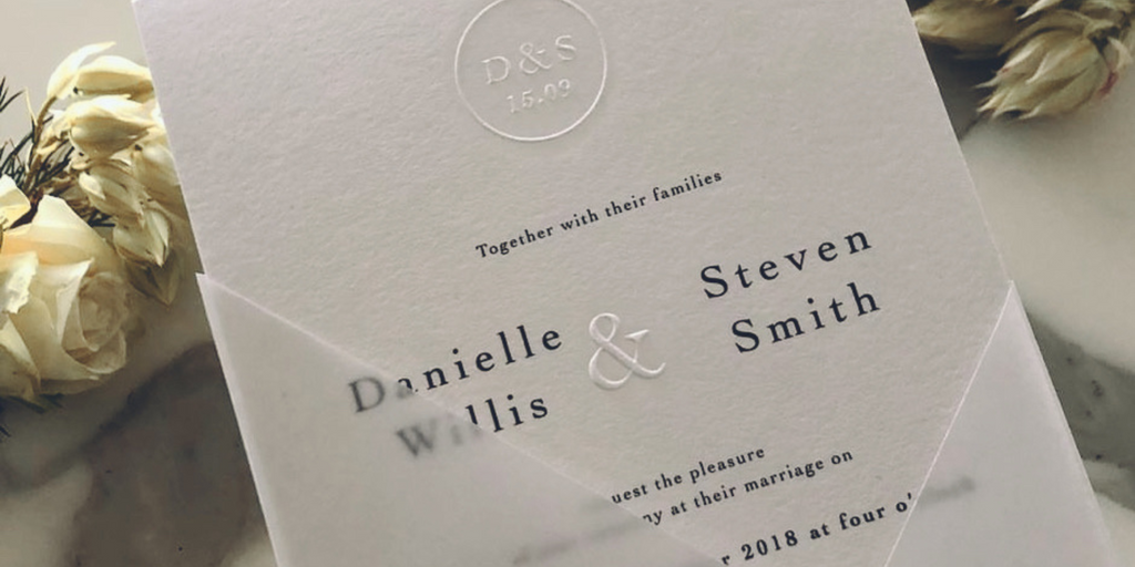 embossed white wedding invitations
